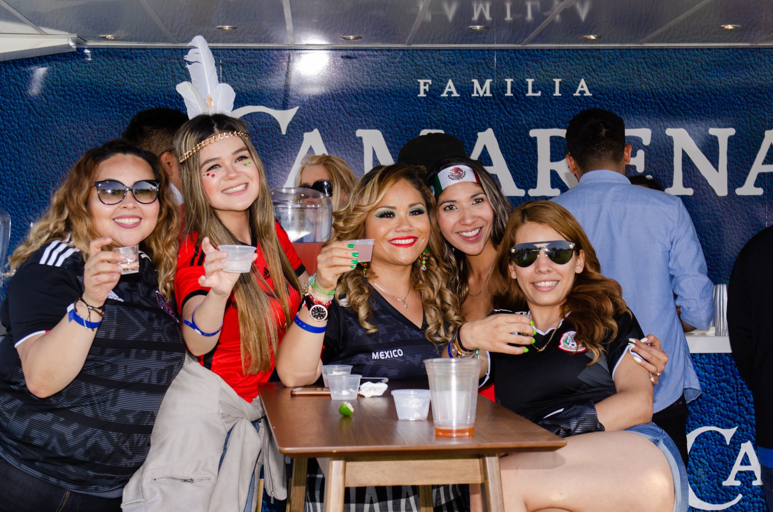 women posing with drinks