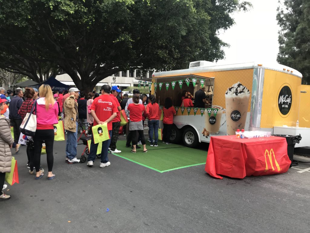 People lining up at a snack truck