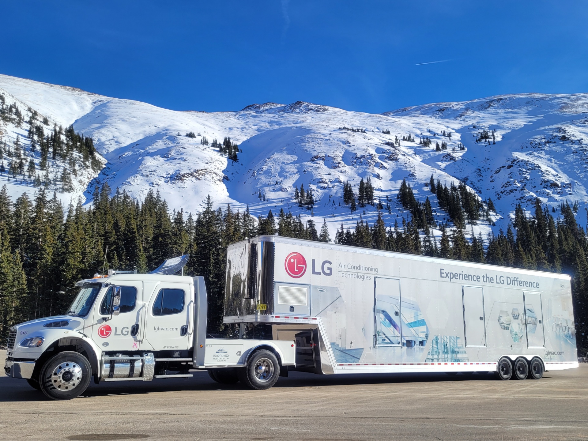 A large white LG mobile trailer