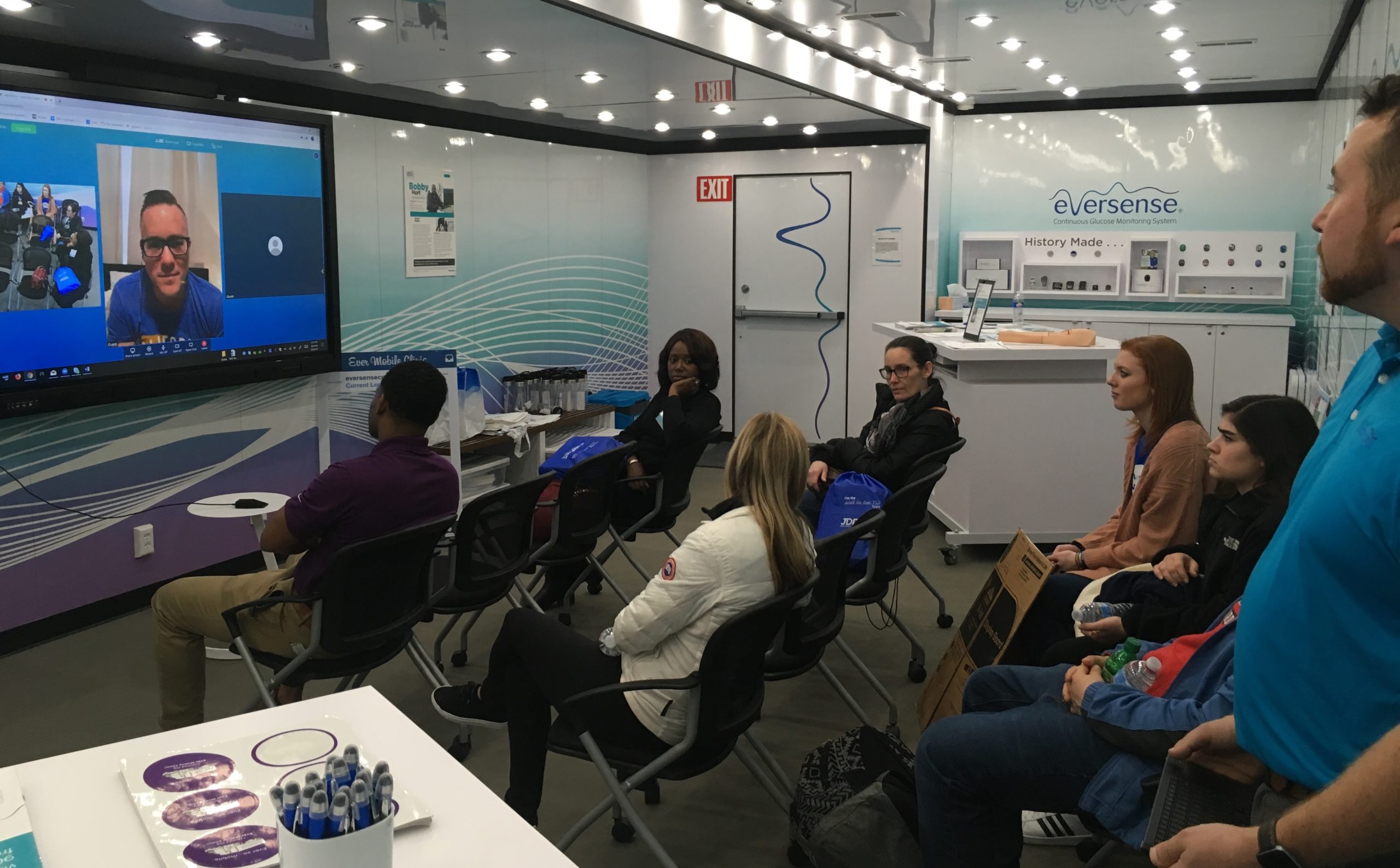 People sitting in Senseonics Berkeley Heights Mobile STEM Education trailer